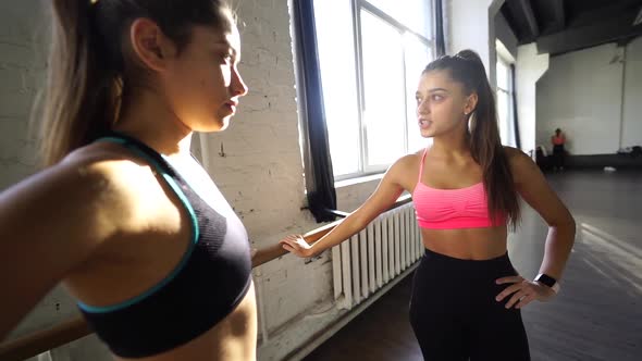 Women Giving Five Each Other After Having a Great Workout in Gym