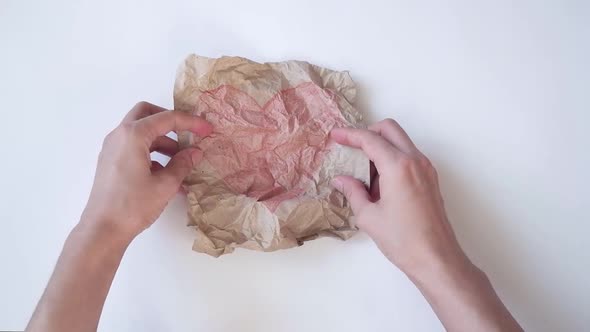 The Woman's Hands Straightened Smoothed the Drawing of a Red Heart on a White Table