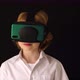 Blonde boy looks with virtual reality glasses and watching VR 360 video again - VideoHive Item for Sale