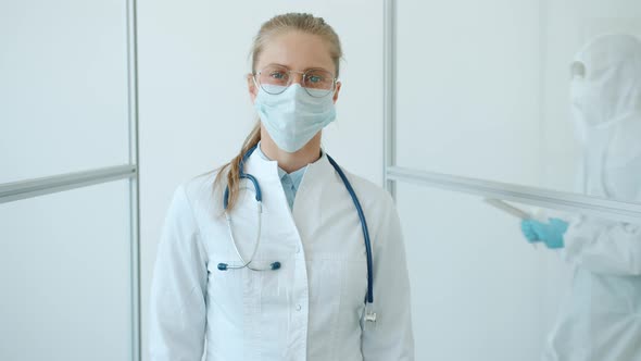 Portrait of Medical Specialist in Uniform and Mask Standing in Corona Virus Hospital