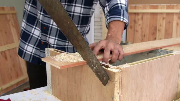 Carpenter Working on Wood Craft at Workshop