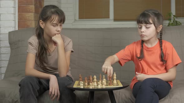 Chess. Sister win chess game. 