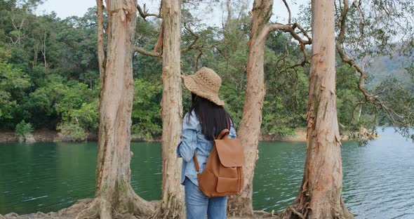 Woman enjoy the view of the lake when hiking