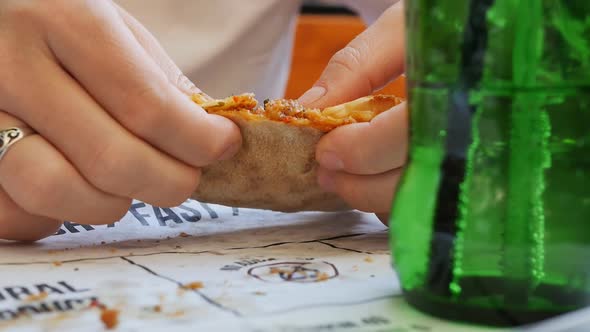 a Woman Eats a Turkish Pide with the Fingers of Her Hand Tears a Slice of Peda with Cheese on a