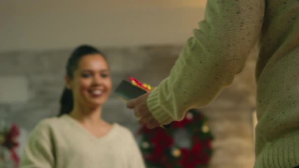 Young Man Hiding Behind His Back the Gift for Girlfriend