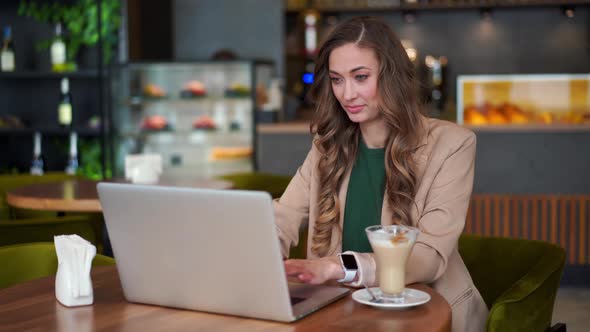 Business Woman Restaurant Owner Use Laptop Dressed Elegant Pantsuit Sitting Table In Restaurant With