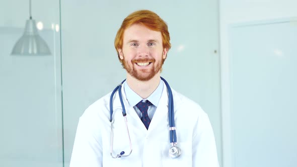 Portrait of Smiling Positive Doctor in Clinic