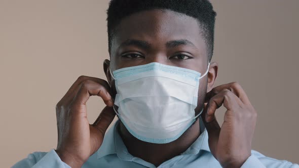 Exhausted Millennial African American Young Man Guy Tired Professional Worker Take Off Medical Face