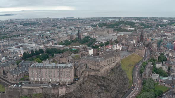 Establishing drone shot back from Edinburgh castle cliff Johnston terrace