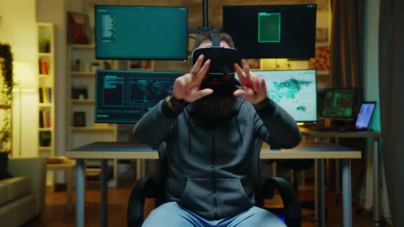 Bearded Hacker Wearing a Virtual Reality Goggles