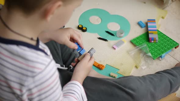 Child Playing Building Blocks Game