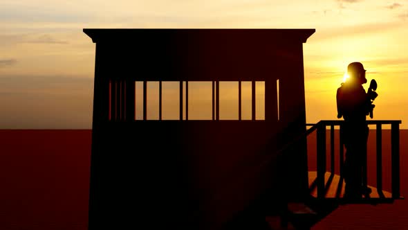 Soldier Watching the Military Watchtower at Sunset