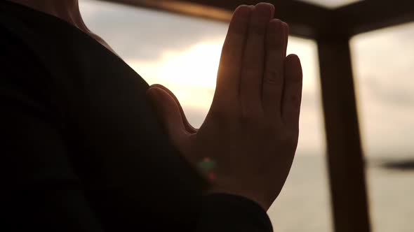 Close Up of Female Hands in Namaste Pose  Woman Relaxing Meditating Enjoying Peace Close to the Sea