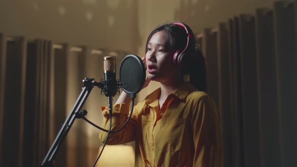 Woman Singing In Recording Studio