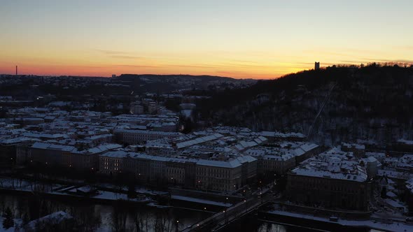 Sunset Skyline Above Prague Czech Republic. Aerial View of Snow Capped Buildings in Twilight by Vlta