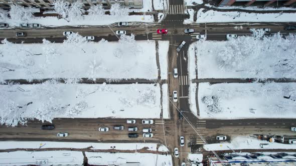 Aerial Top Down View of Snowy City Asphalt Road Landscapes in Winter