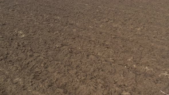 Brown soil after ploughing 4K drone footage