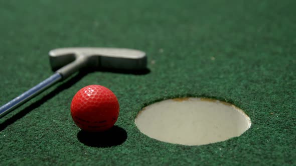 Golf putter and golf ball on a artificial turf 4k