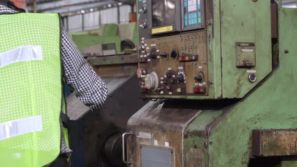 Smart Factory Worker Using Machine in Factory Workshop