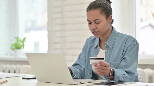 Online Shopping Failure for Young African Woman on Laptop