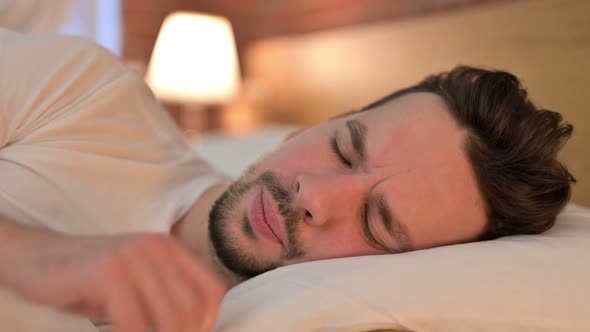 Portrait of Sick Young Man Having Coughing in Bed