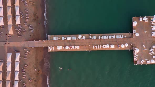 Resort Coast with Wooden Pier in the Sea, Aerial View.