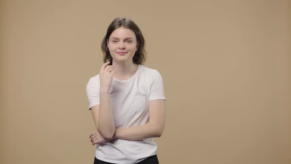 Portrait of Model with Natural Beauty is Thinking About Something Happy That an Idea Coming to Her