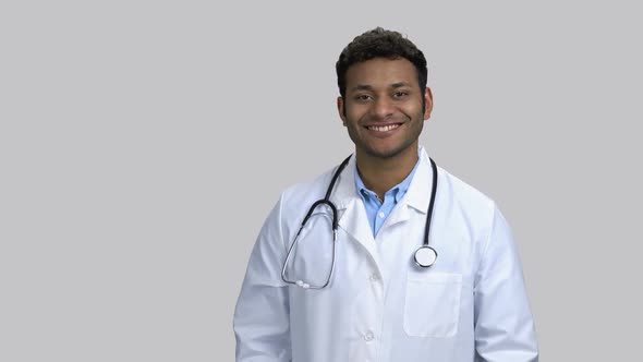 Portrait of Smiling Darkskinned Doctor with Stethoscope