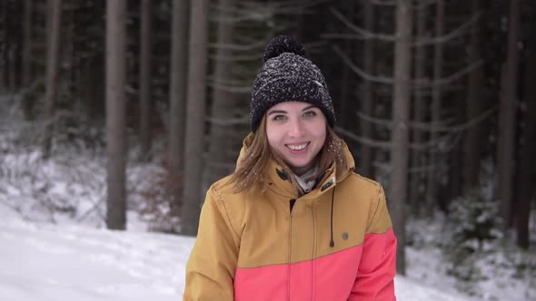 Woman Go to the Camera in Winter Snow Forest and Waving Hand Hello