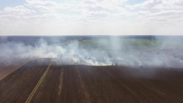 Burning Stubble Fire Line on Field