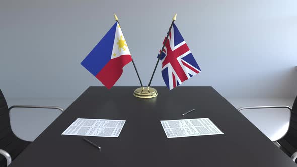 Flags of Philippines and the United Kingdom and Papers