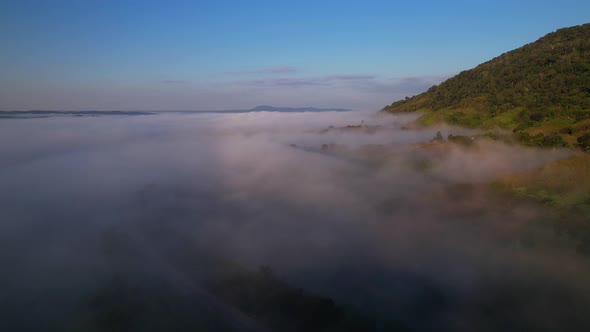 4K Aerial view of Mountains landscape with morning fog.