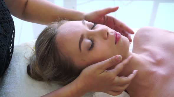 Woman Gets Facial and Head Massage in Luxury Spa