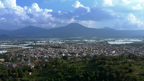 AERIAL: Tangancicuaro City, Mexico, Forest, Clouds, Mountains (Flying Forward)