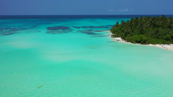 Aerial view scenery of tranquil bay beach lifestyle by blue water and white sand background of a day