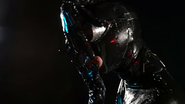 Female Bdsm Lover in Black Latex Bodysuit and Full Face Mask Costume for Bdsm Role Playing