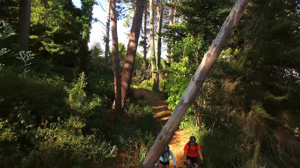 Hiker couple cycling in the forest