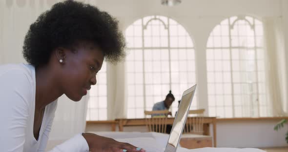 Woman using a laptop at home