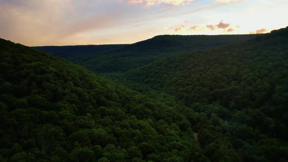 Stunning drone video footage of a stunning Appalachian Mountain Valley During Summer at Sunset with
