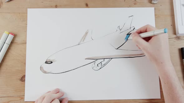 Timelapse of artist drawing an airplane flying