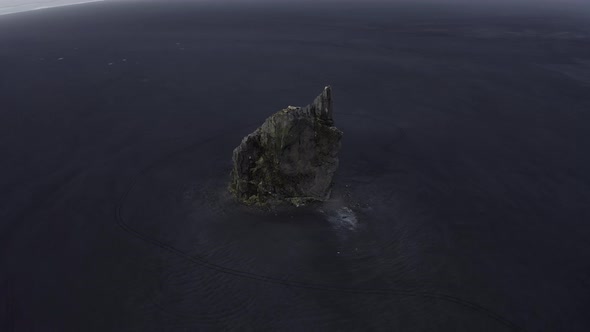 Drone Orbiting Shot of the Famous Arnardrangur Sea Stack in Iceland