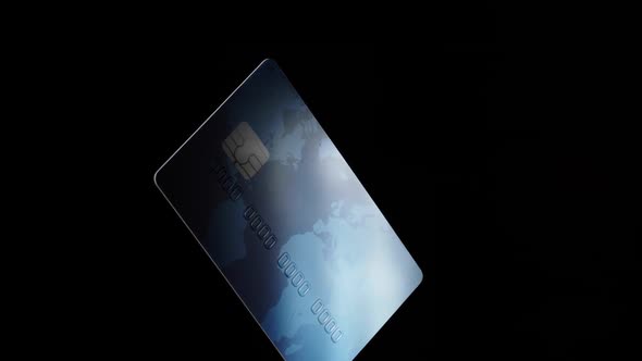 Credit Plastic Card Turning Spinning Isolated on Black Background Online Payment Operations Concept