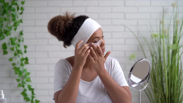 Portrait of young woman with eye pad under eye