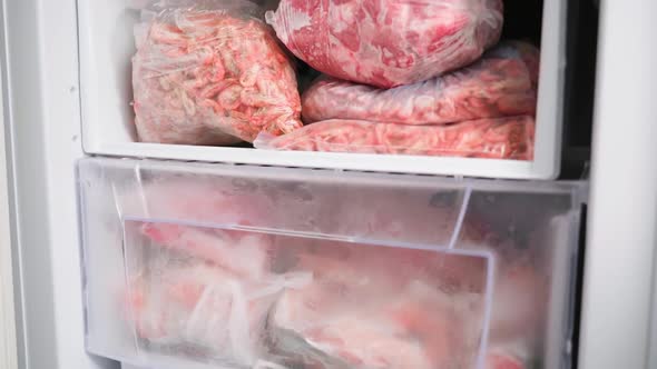 The Freezer Compartment of the Refrigerator is Filled with Meat Products