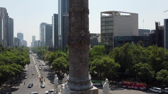 A tilt up shot of the angel of Independence stands in the center of a roundabout in Mexico City, Mex