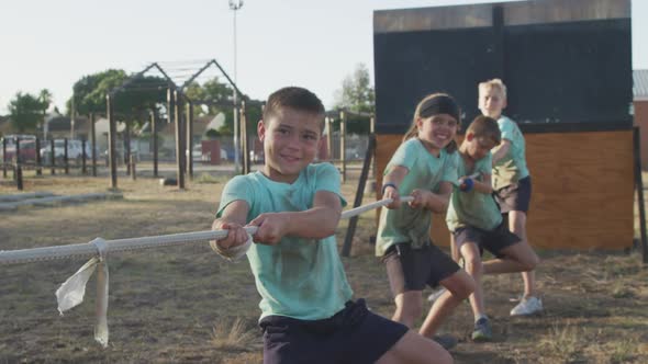 Group of Caucasian children training at boot camp