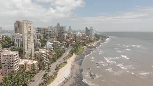 Drone shot trucking over beach front apartments