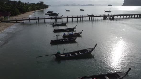 Aerial view from drones of fishing boats in the shore during low tide. alt