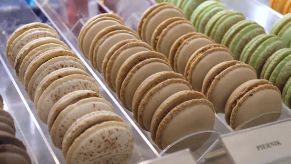 Variety of French Macaroons on a Display in Patisserie. French Desserts 