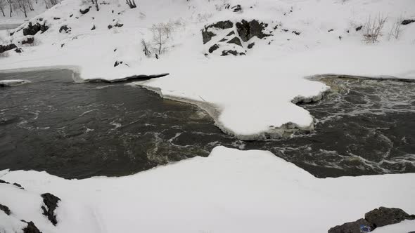 Winter River Before Spring in a Bright Winter Forest